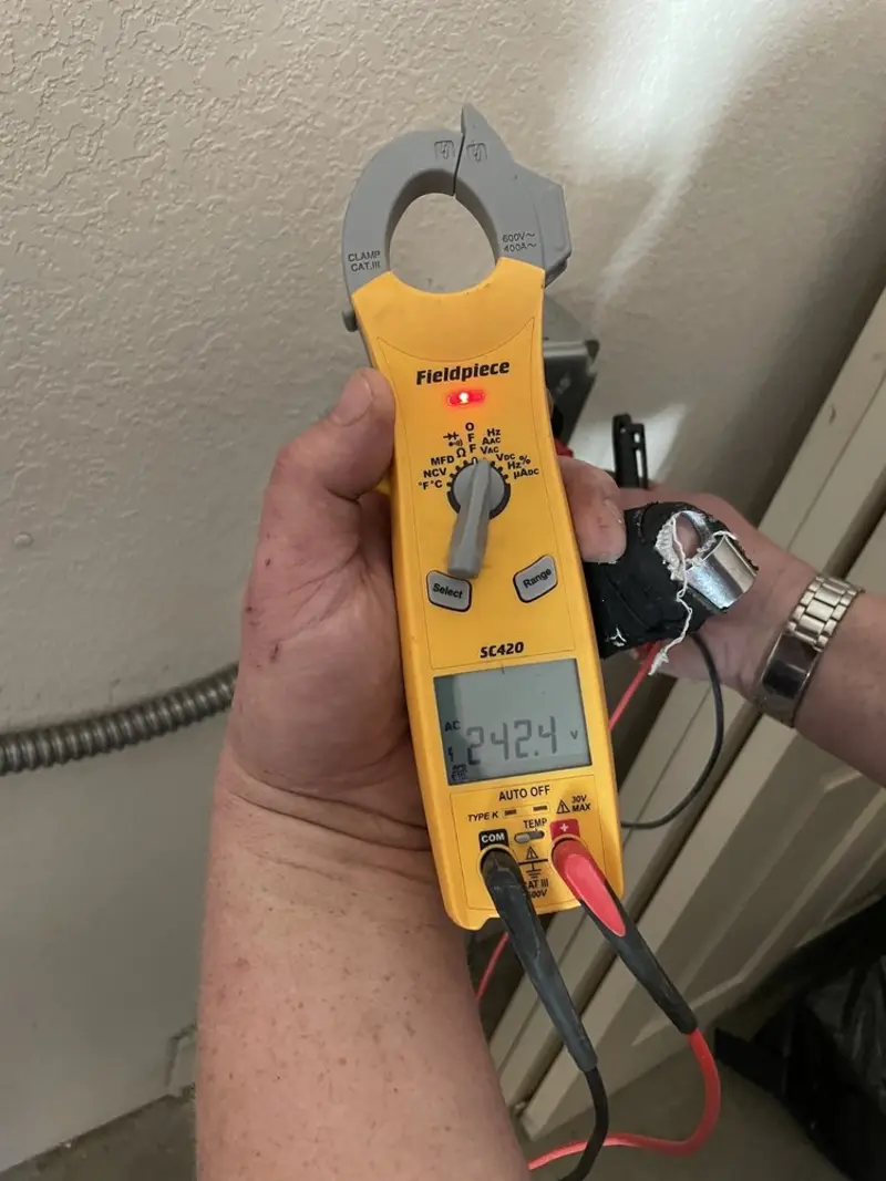 Voltage testing with clamp meter during Recessed Lighting Installation in Hartford
